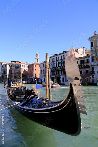 A gondola moored to the pier at the Grand Canal in Venice, Italy © schusterbauer.com
