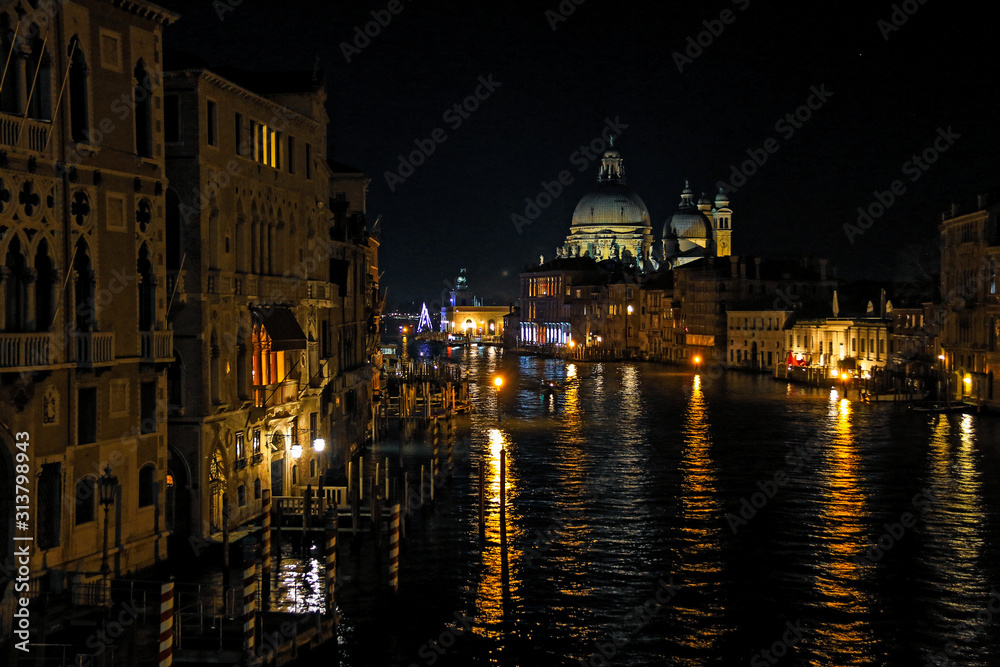 Night view of the Basilica di Santa Maria della Salute and the Canal Grande in Venice, Italy
