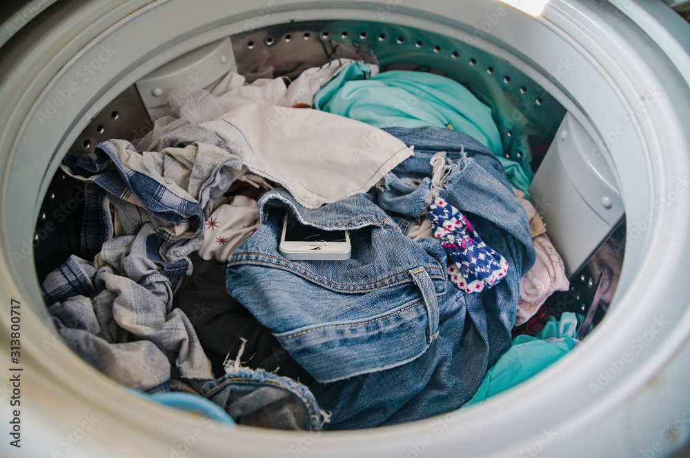 Smartphone in washing machine,Forgotten cell phone in pocket, pant or shirt Smartphone in washing machine,Forgotten cell phone in pocket, pant or shirt