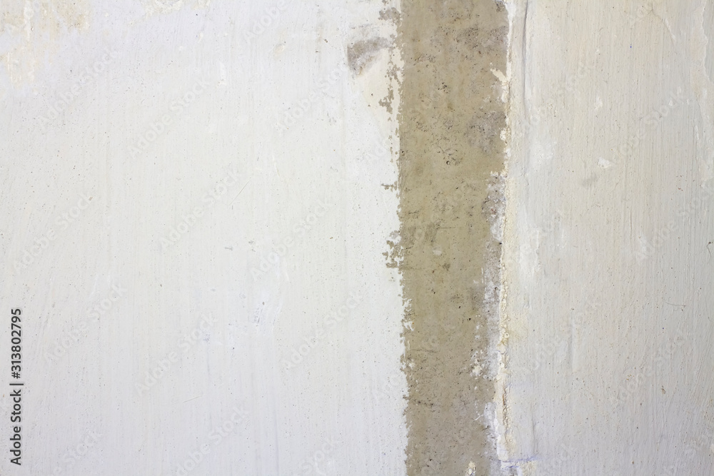 Fototapeta premium concrete wall with cement plaster with a strip in the middle