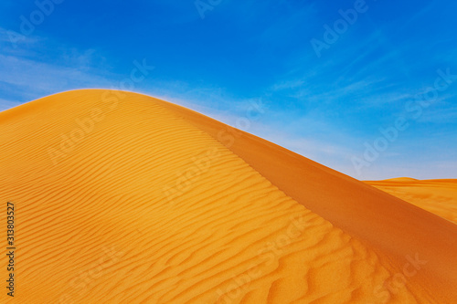 Red Sand Desert Barchan and Blue Sky Lanscape photo