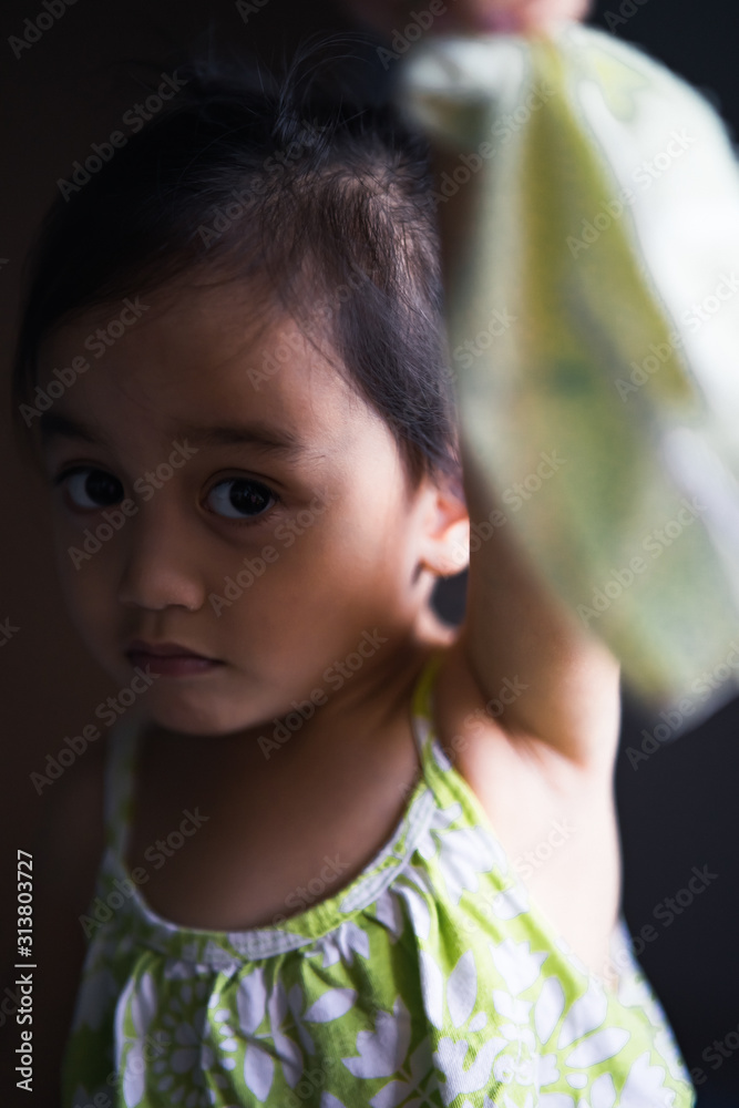 Portrait of an asian toddler at home making cute expression. Portrait of an asian toddler at home making cute expression.