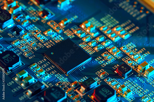 Electronic circuit board with electronic components such as chips close up. The concept of the electronic computer hardware technology. 