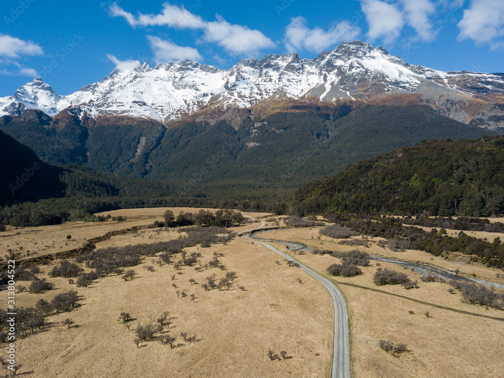 Aerial view of the glacial Rees Dart river valley with Mt Aspiring National Park, Southern Alps, vista backdrop forming an iconic New Zealand landscape. New Zealand is famous for it's landscape. Aerial view of the glacial Rees Dart river valley with Mt Aspiring National Park, Southern Alps, vista backdrop forming an iconic New Zealand landscape. New Zealand is famous for it's landscape.