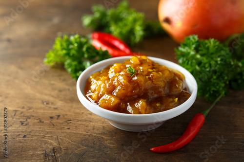 Homemade spicy mango chutney photo