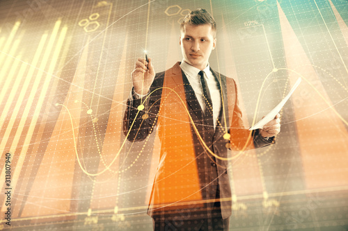 Businessman and forex graph hologram. Double exposure. Concept of financial education and analysis