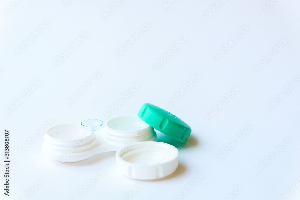 Close up shot of contact lenses container open ready to pick up and wear. Good and convenient solution to improve eye visual better eyesight more comfort. No need to wear glasses. Close up shot of contact lenses container open ready to pick up and wear. Good and convenient solution to improve eye visual better eyesight more comfort. No need to wear glasses.