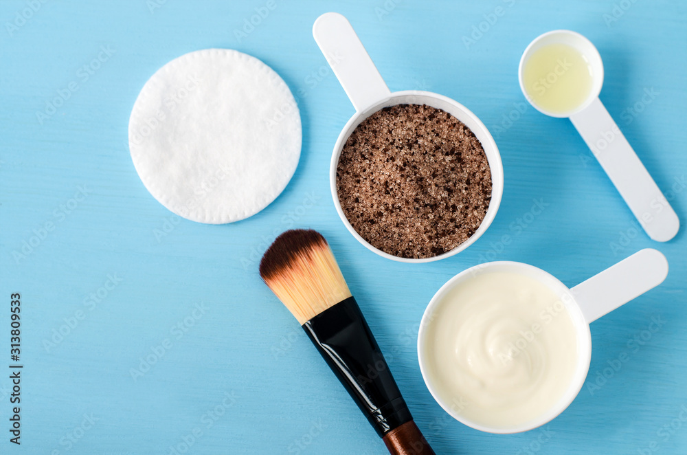 Sour cream (greek yogurt), ground coffee with brown sugar and olive oil in the small scoops. Ingredients for preparing diy masks, scrubs, moisturizers. Homemade cosmetics recipe. Top view, copy space. Sour cream (greek yogurt), ground coffee with brown sugar and olive oil in the small scoops. Ingredients for preparing diy masks, scrubs, moisturizers. Homemade cosmetics recipe. Top view, copy space.