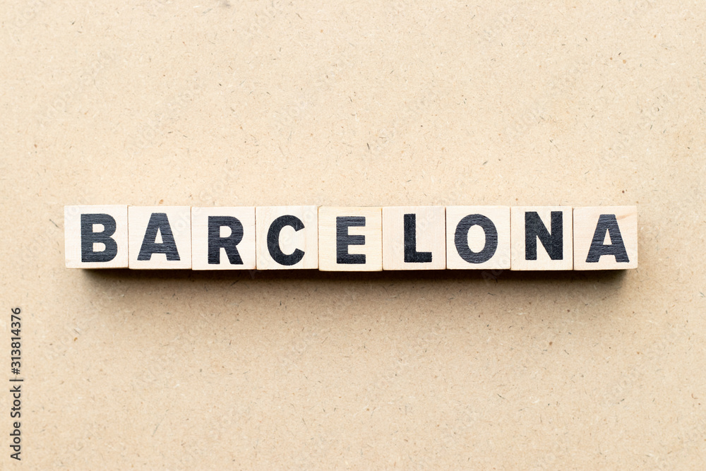 Alphabet letter block in word barcelona on wood background