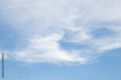 Clear blue sky with white cloud background