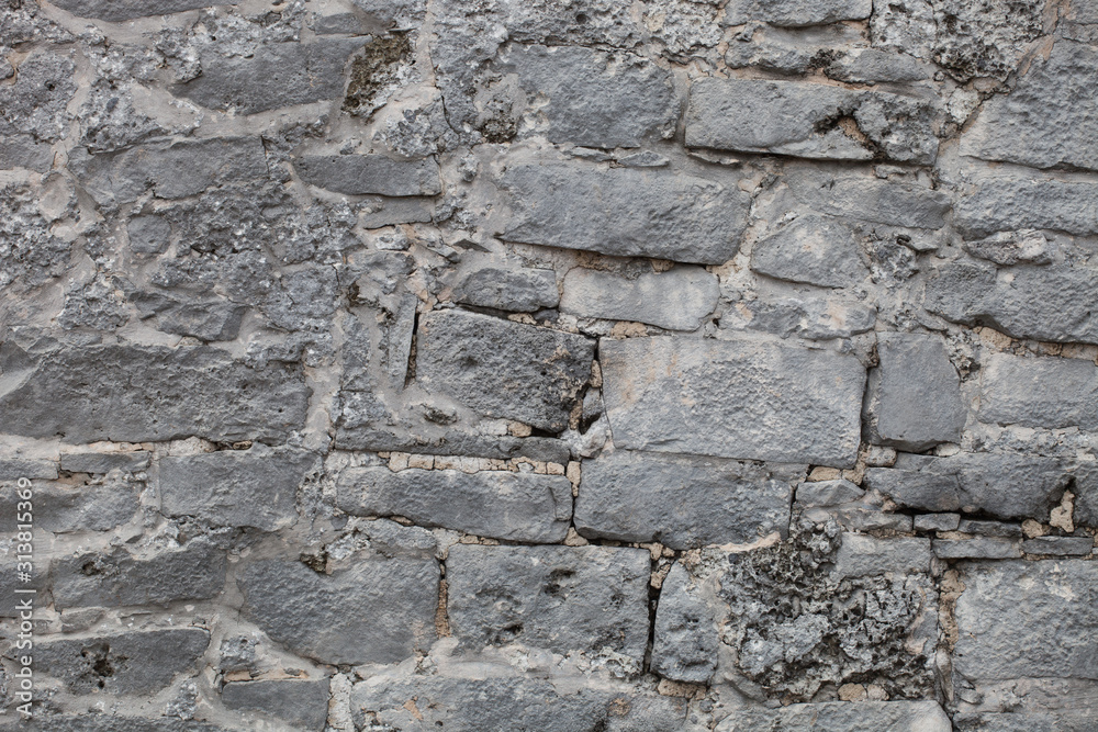 Rough weathered ancient mayan stone  wall surface texture close up