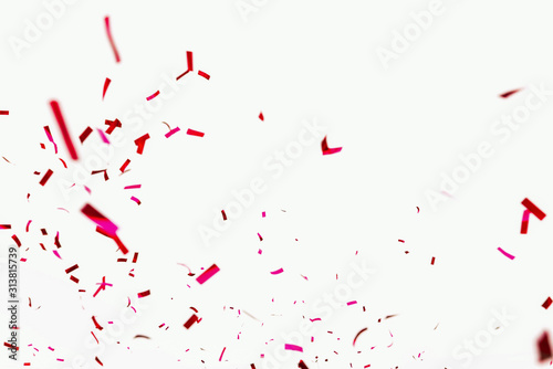 Confetti explodes on a white background. Festive salute of shiny red paper. Background decoration for a holiday, party, birthday or anniversary. Pieces and scraps of red ribbon