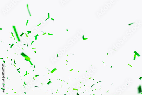 Green confetti elements on a white background. Confetti shot at a party, anniversary go birthday. Festive mood. Festive decor