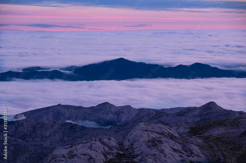 Beautiful cloud Inversion seen from Naranjo de Bulnes where the clouds drop below the mountains.