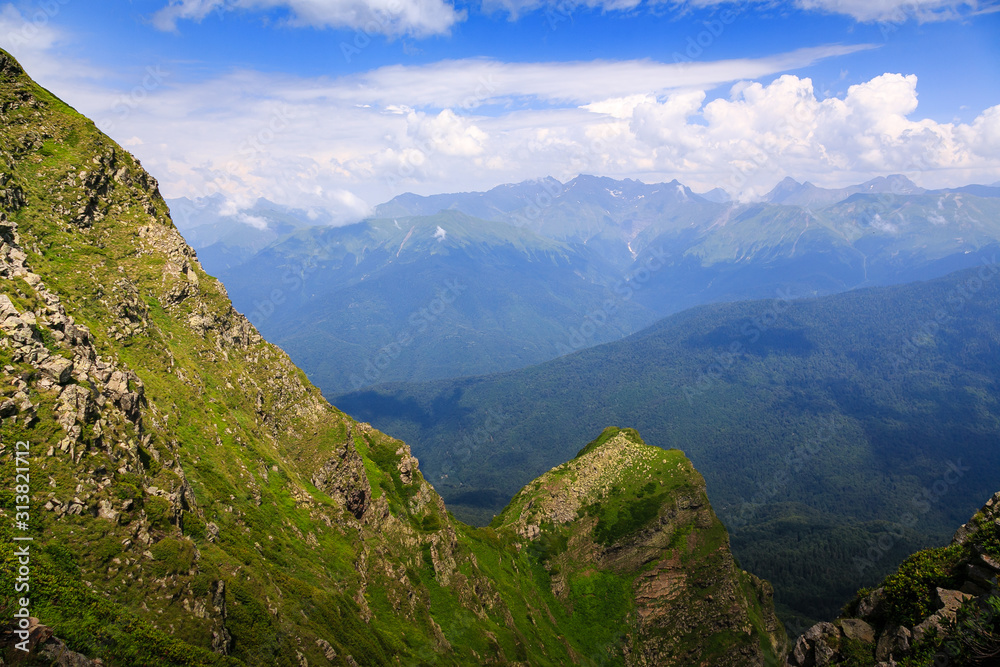 Beautiful mountain landscape in summer. Mountains with flowering Alpine plants.