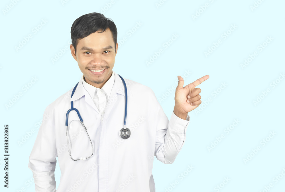 Young doctor smiling with stethoscope and pointing up with one finger got a good idea on blue pastel background. Young doctor smiling with stethoscope and pointing up with one finger got a good idea on blue pastel background.