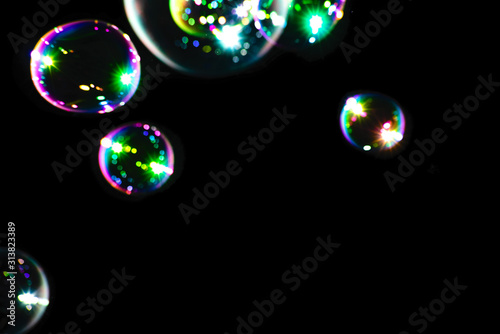 Colorful soap bubbles on a dark background