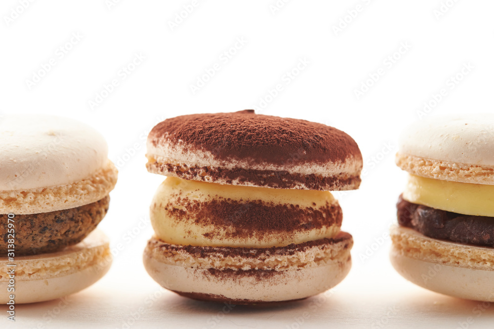 Various macaroons on white background 