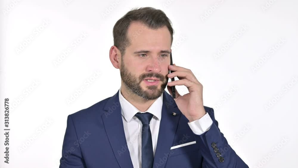 Businessman Talking on Smartphone, White Background Businessman Talking on Smartphone, White Background