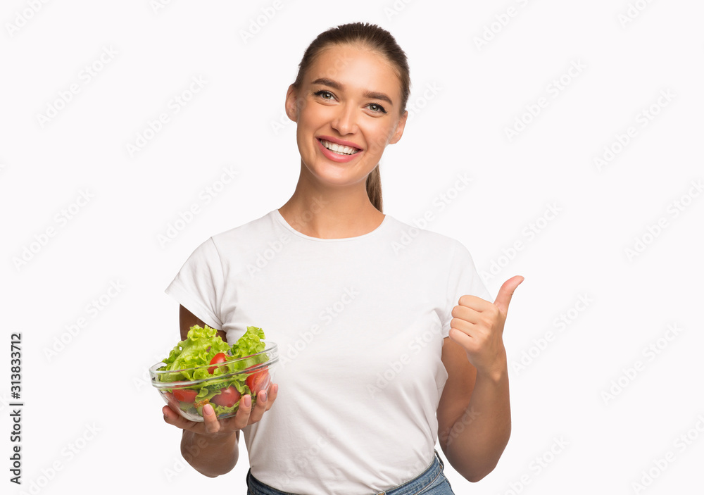 Lady Holding Vegetable Salad Gesturing Thumbs-Up Approving Diet, Studio Shot Lady Holding Vegetable Salad Gesturing Thumbs-Up Approving Diet, Studio Shot