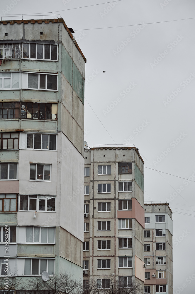 abandoned high-rise building of the Soviet Union in the winter in the city