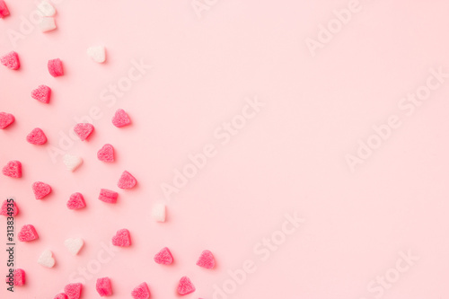 Composition for Valentine's Day. Pink hearts on pastel pink background. Valentine day concept, design. Flat lay, top view, copy space, banner