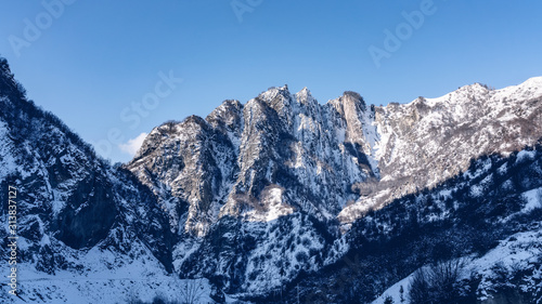 Snow covered mountain range landscape © Vastram