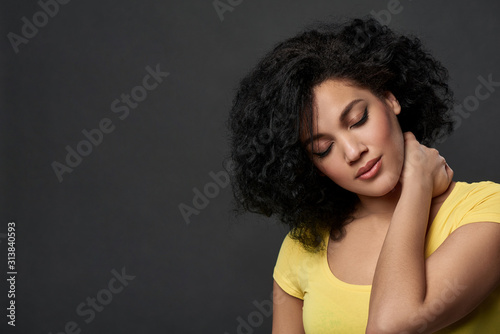 Tired woman touching her neck