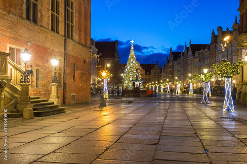 Beautiful architecture of the Long Lane in Gdansk with Christmas ligths at dawn, Poland.