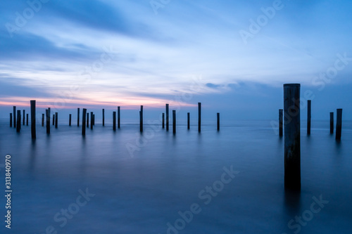 Poles at the sea during blue hour © Silvio