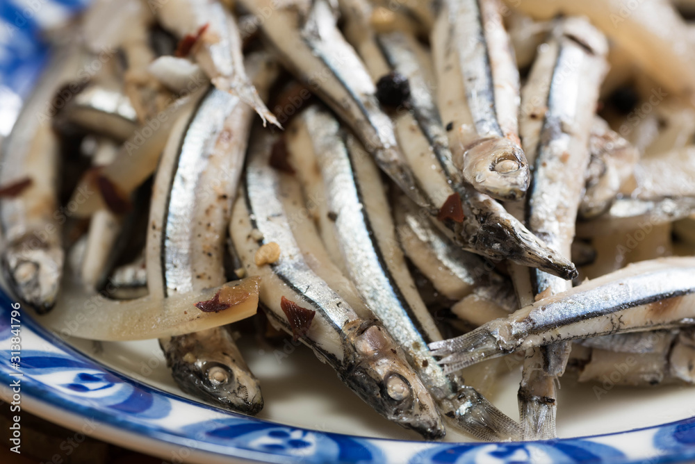 Paksiw na dilis is a Filipino dish of simmered anchovies in vinegar