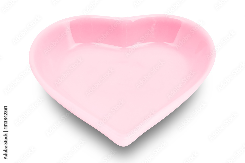 Red plate in shape of heart isolated on white background. Red plate in shape of heart isolated on white background.