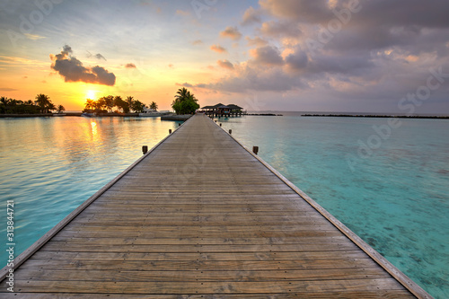 Footbridge of Paradise Island  Lankanfinolhu  at sunset  Maldives