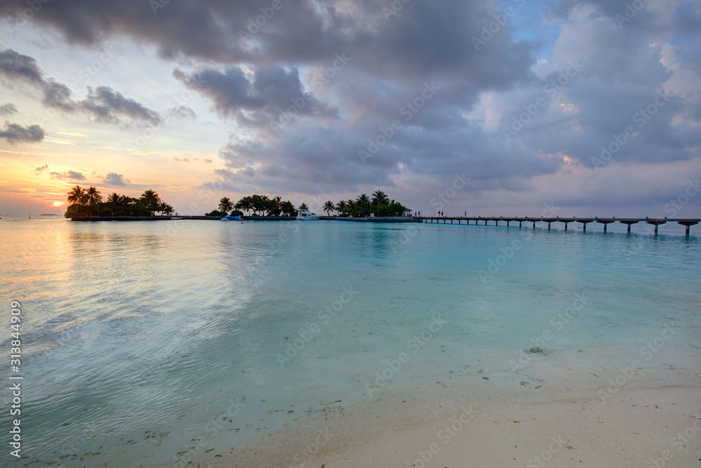 Footbridge of Paradise Island (Lankanfinolhu) at sunset, Maldives