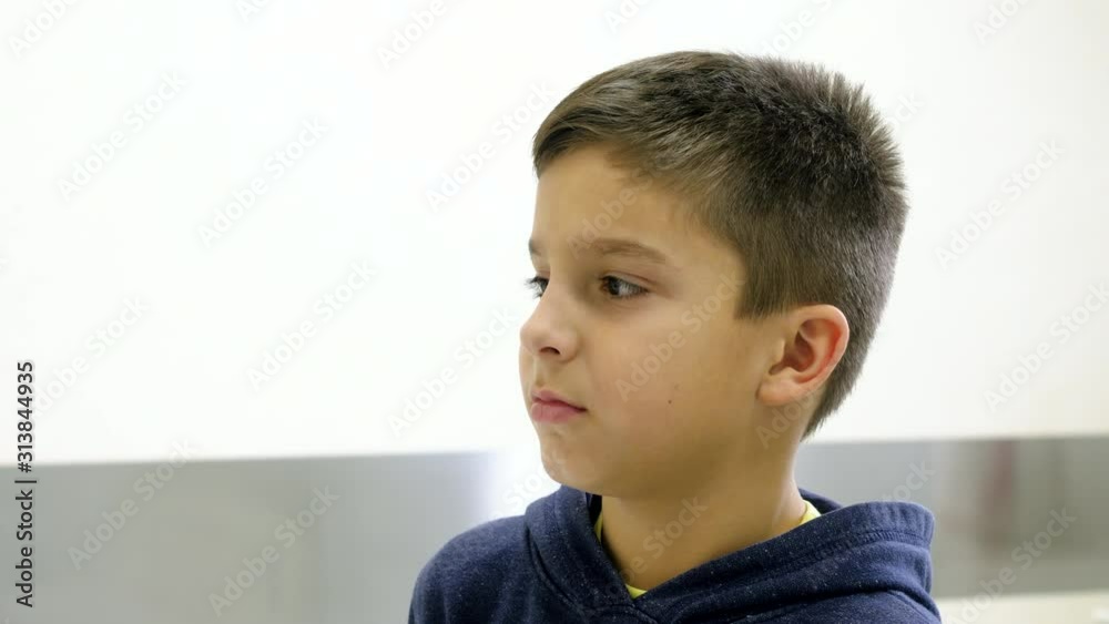 Closeup of worried cute little boy sitting in a hospital. 4K Closeup of worried cute little boy sitting in a hospital. 4K