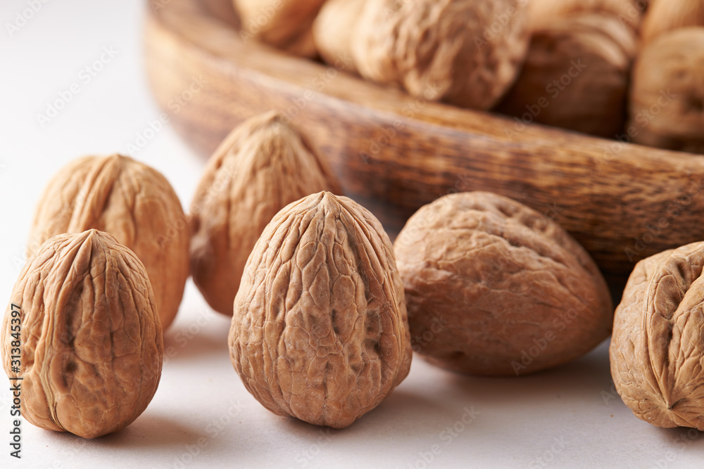 Heap of walnuts on white background Heap of walnuts on white background