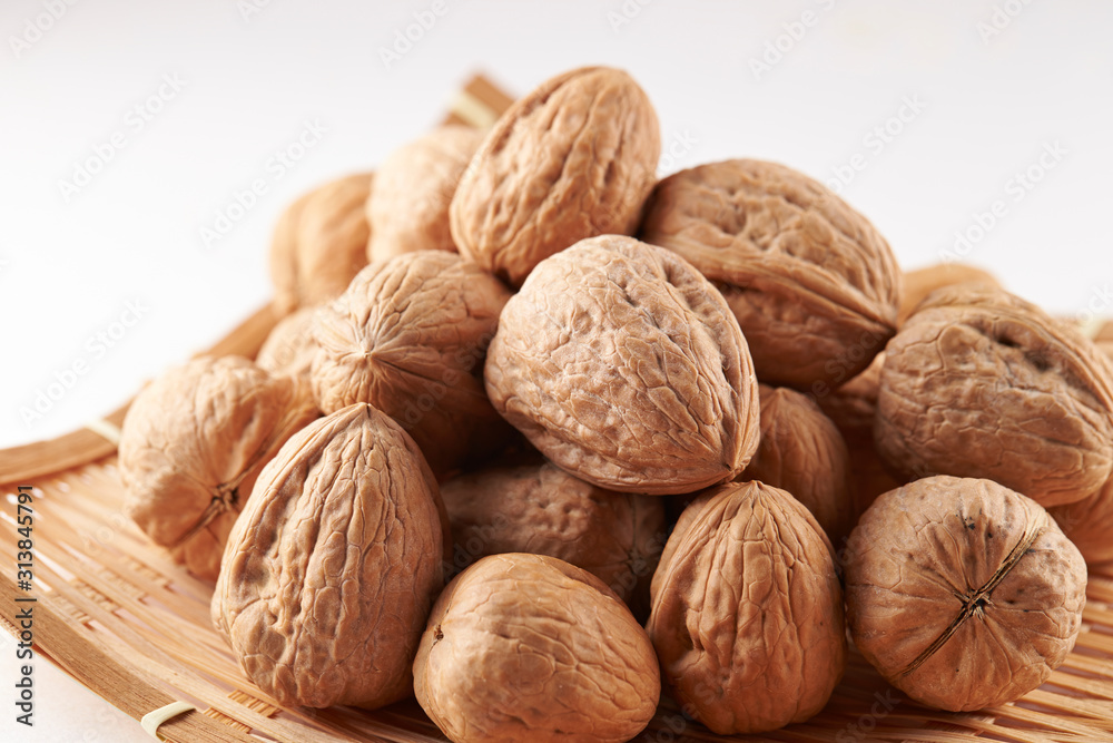 Heap of walnuts on white background Heap of walnuts on white background