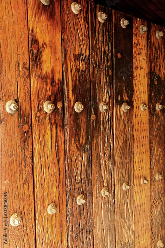 Heavy wooden entrance door from recycled railway sleepers