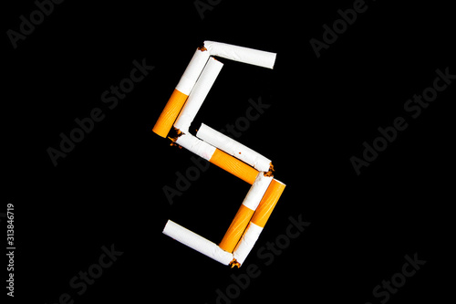Cigarettes with filter on a black background