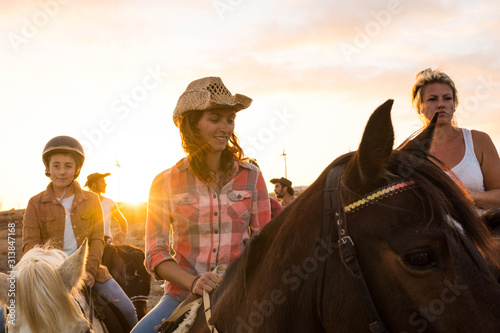 group of people riding on a horses together having fun and learning ride - walking on a horse