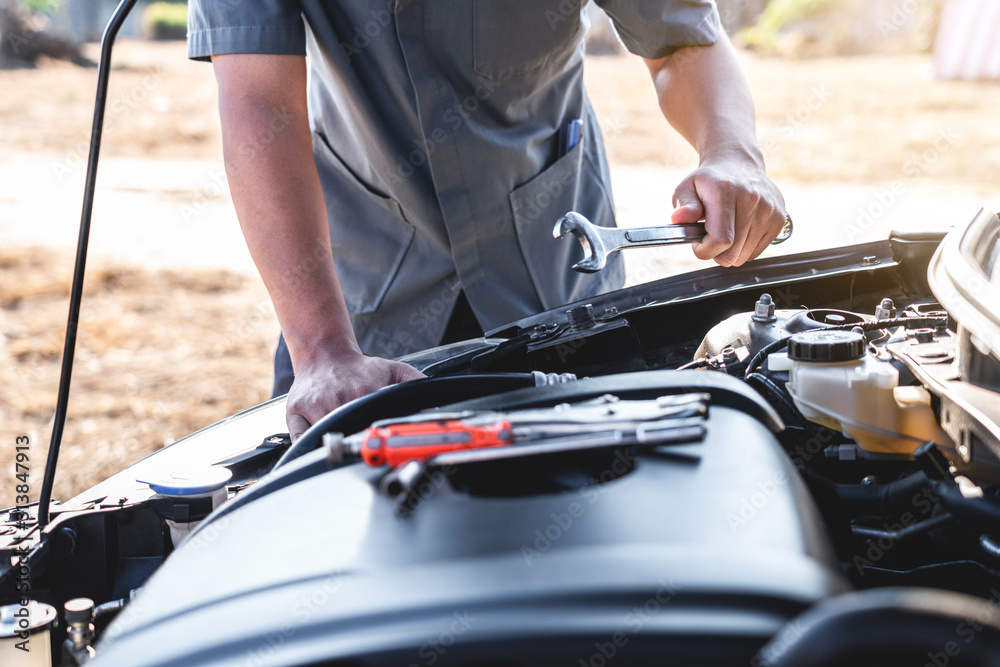 Technician hands of car mechanic in doing auto repair service and maintenance worker repairing vehicle with wrench, Service and Maintenance car check Technician hands of car mechanic in doing auto repair service and maintenance worker repairing vehicle with wrench, Service and Maintenance car check