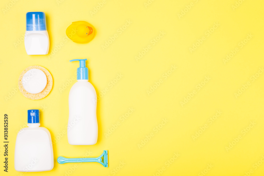 Woman Bath cleaning care morning routine top view flat lay composition with white, blue yellow items on yellow desk. Woman Bath cleaning care morning routine top view flat lay composition with white, blue yellow items on yellow desk.