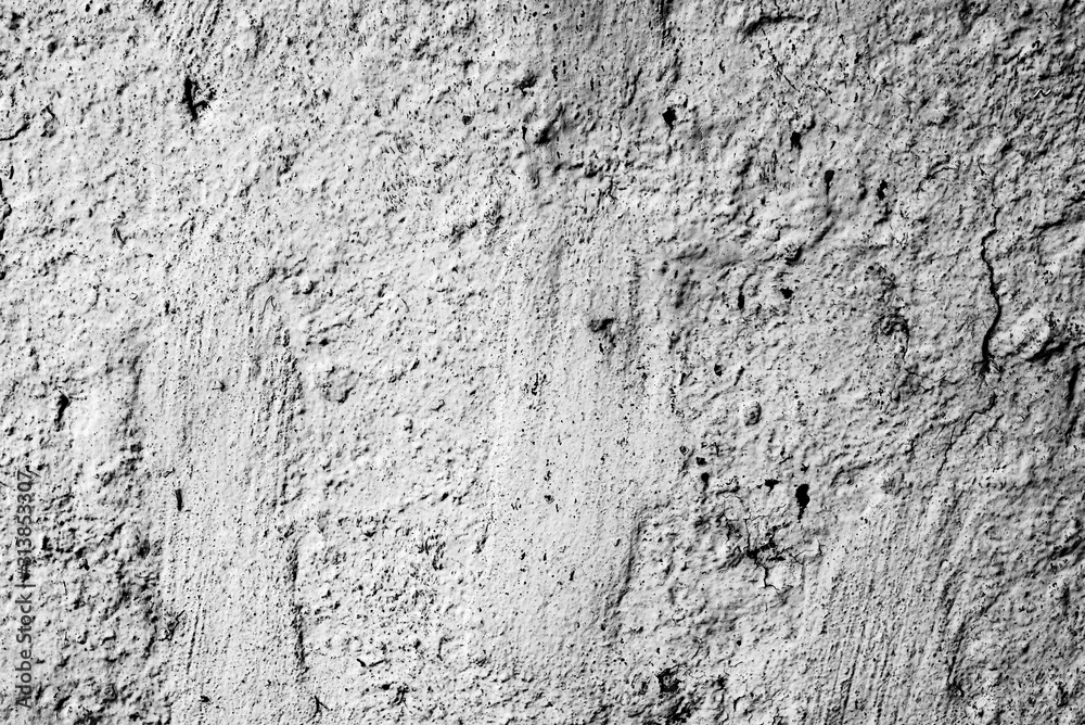 Texture of a concrete wall with cracks and scratches which can be used as a background