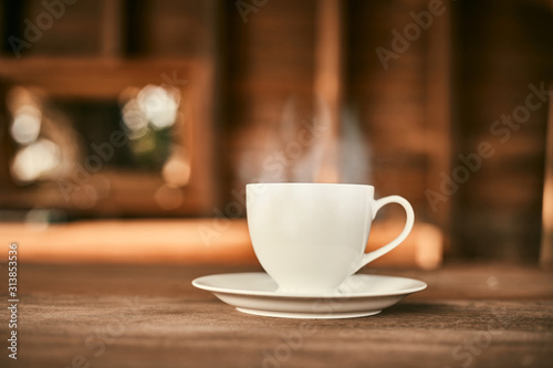 Coffee cup on wooden table..