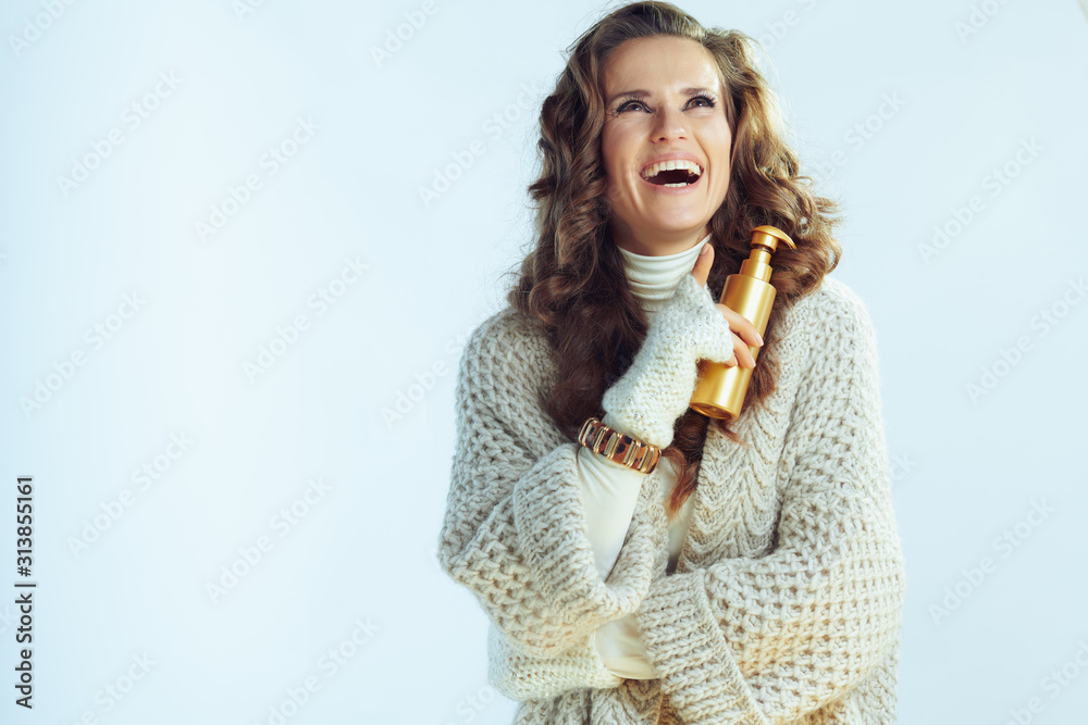 happy female with self tanning lotion looking at copy space
