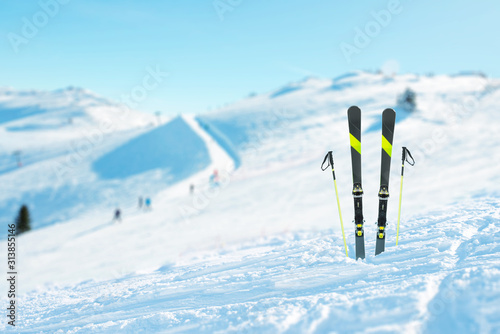 Photography Skis and poles pinned into the snow