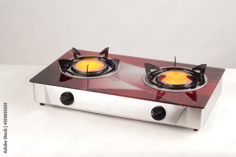 Fototapeta premium kitchen gas stove with burning burners isolated