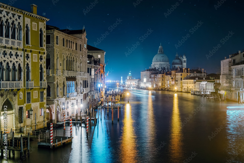 Venice, December 23, 2019 - classic view on the Grand Canal from the Accademia bridge, in the background Punta della Dogana.