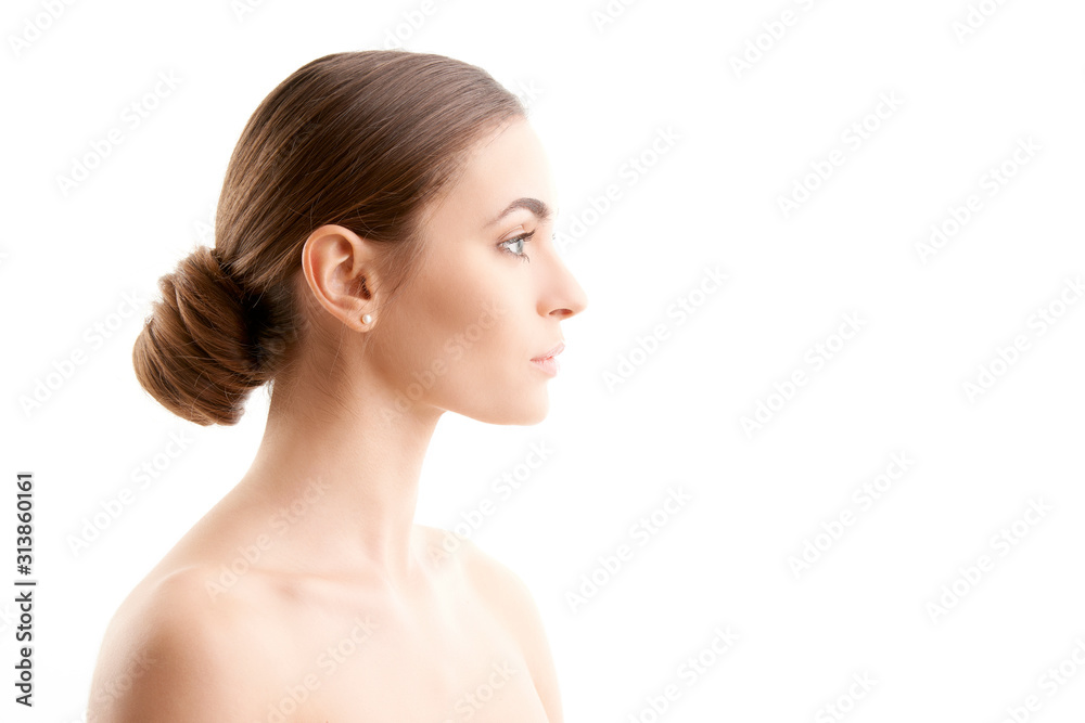 Profile of young woman smiling against isolated background Profile of young woman smiling against isolated background