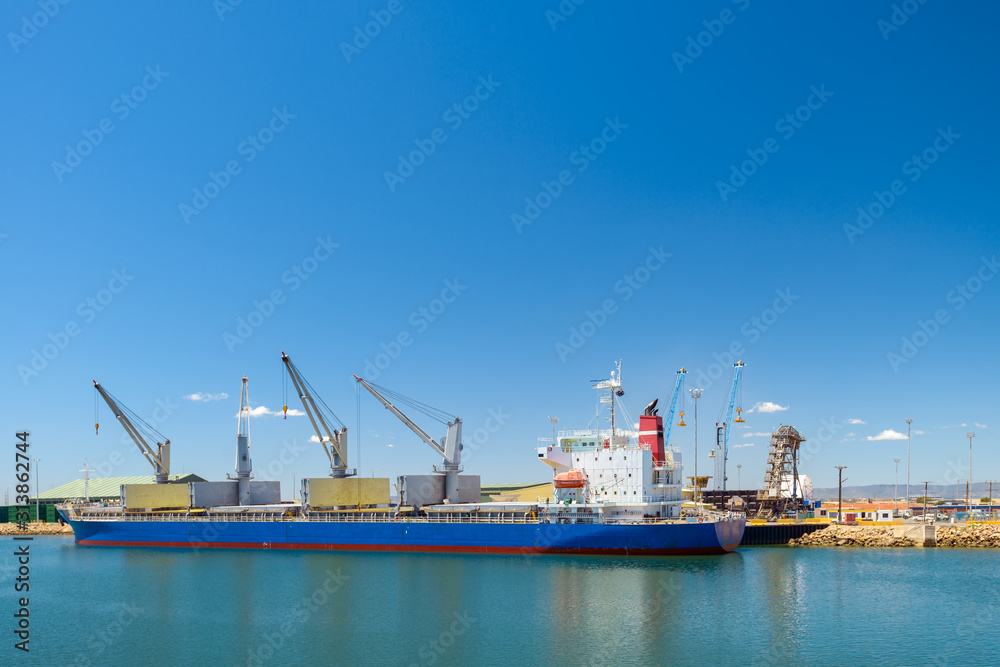 Cargo ship docked in industrial port